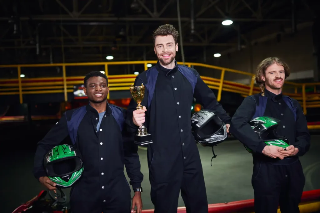 happy driver holding golden cup and standing